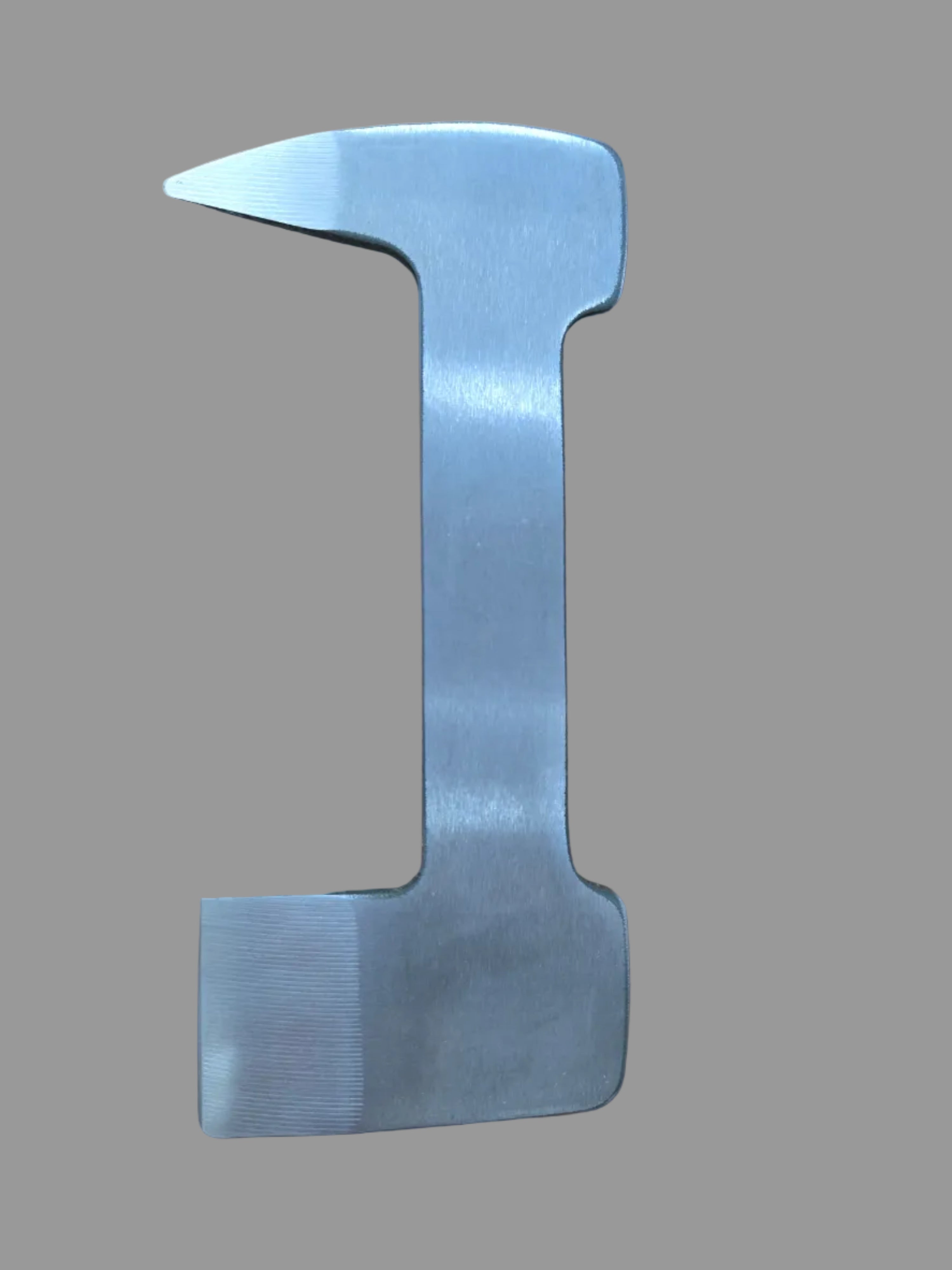 Metal tool on a wooden surface